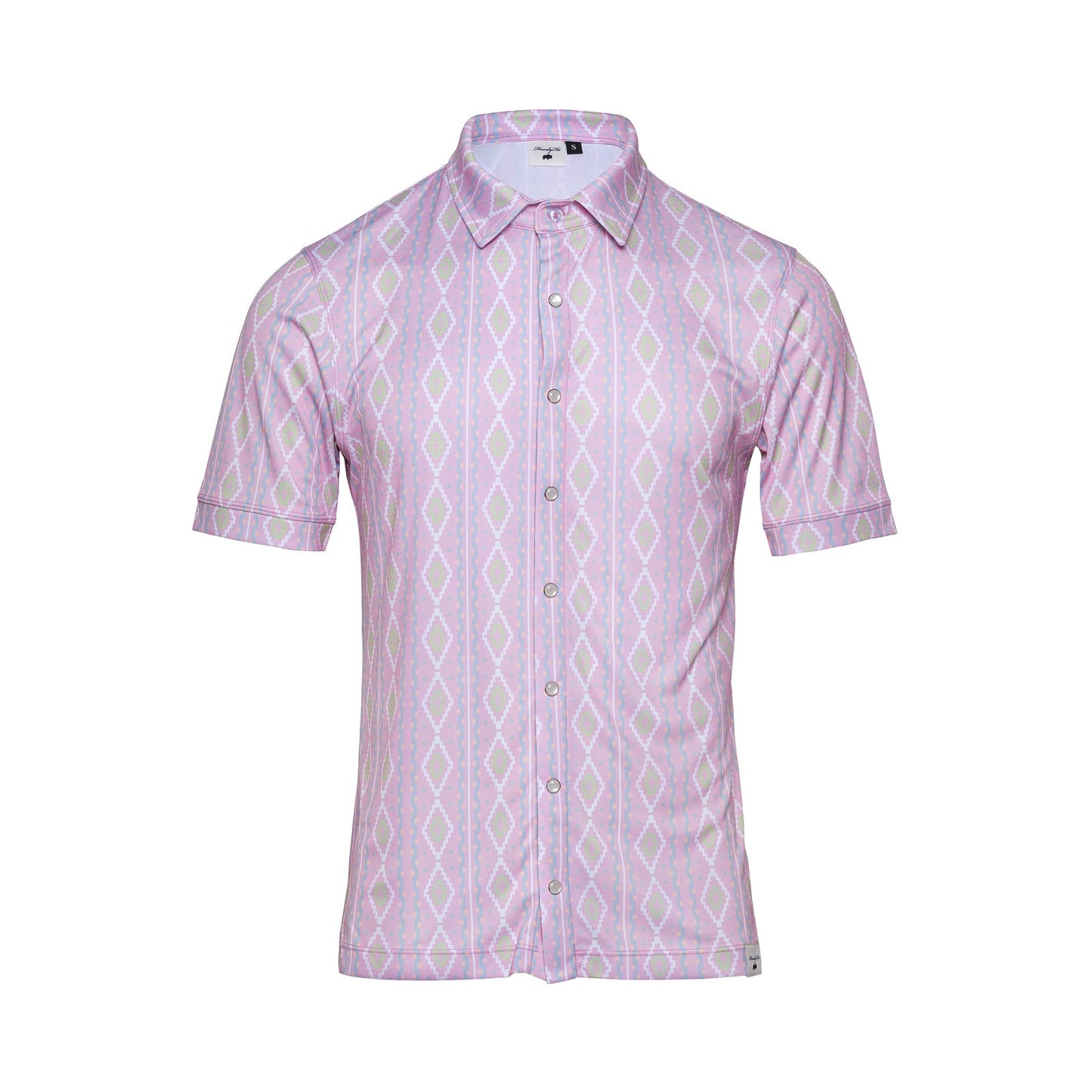 The HowdyHo Rose Quetzal shirt, showcased on a white background, presents a light pink base adorned with unique green and white diamond patterns. This short-sleeved, button-up shirt features a crisp pointed collar and a single pocket, offering a blend of classic style and modern charm.